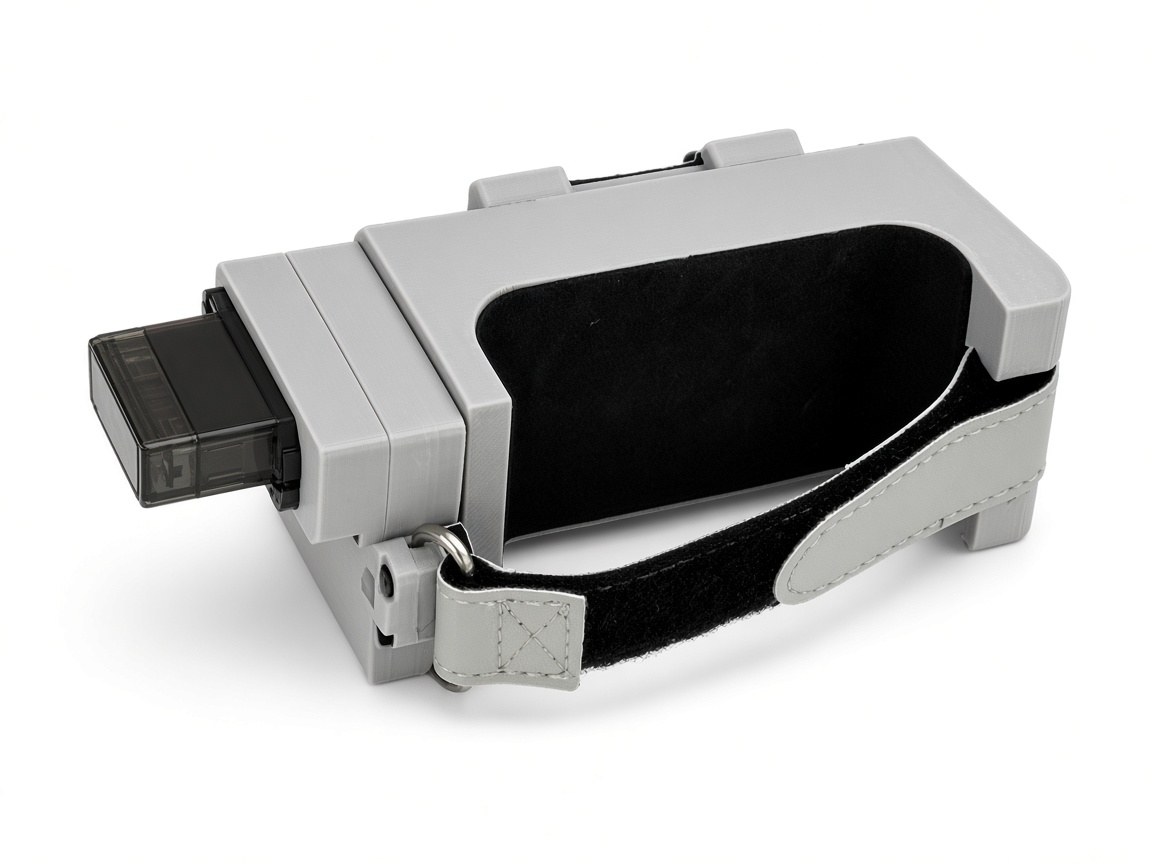 FlySpark Mothership drone release mount three-quarter view – grey single-lock body, micro servo, top latch lugs and hook-and-loop strap