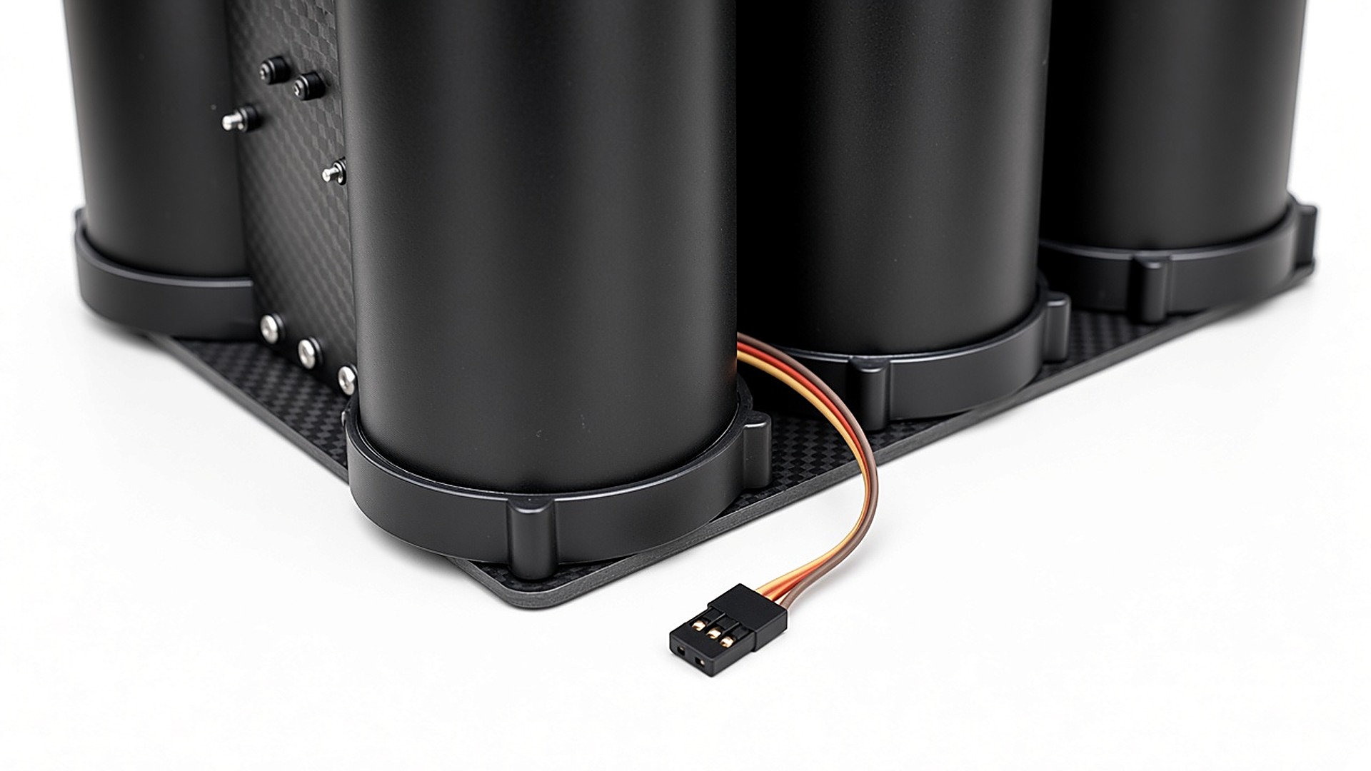 FlySpark QD60 PWM drone dropper servo lead and 3-pin connector detail on the carbon-fibre base plate