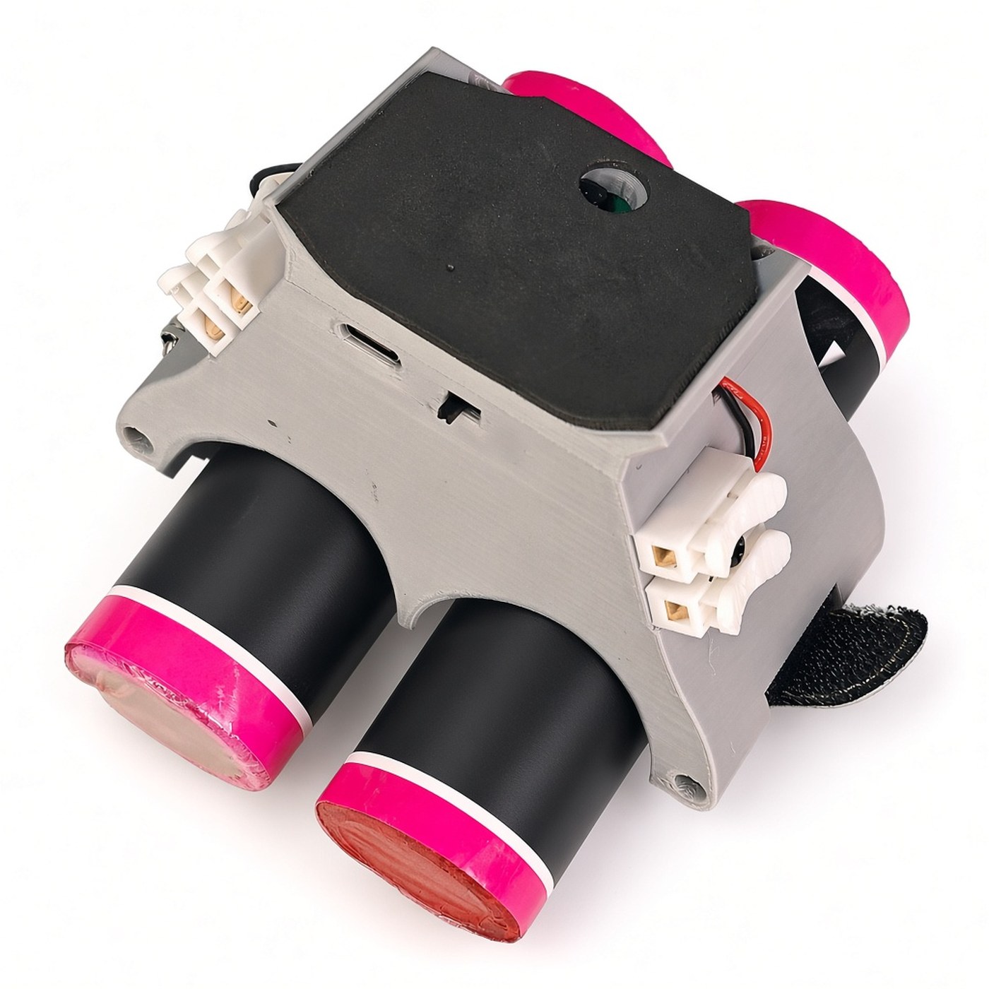FlySpark SMOKER2 drone smoke generator three-quarter view – light-sensor window in the foam pad, USB-C port and power switch