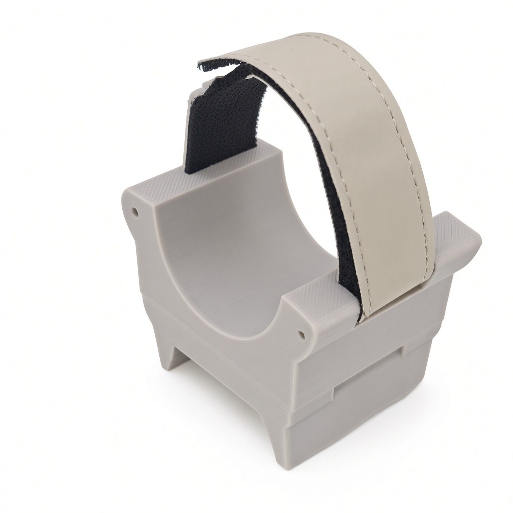 FlySpark ZD1-V3 drone payload dropper empty, showing the curved conforming cradle and open retention strap