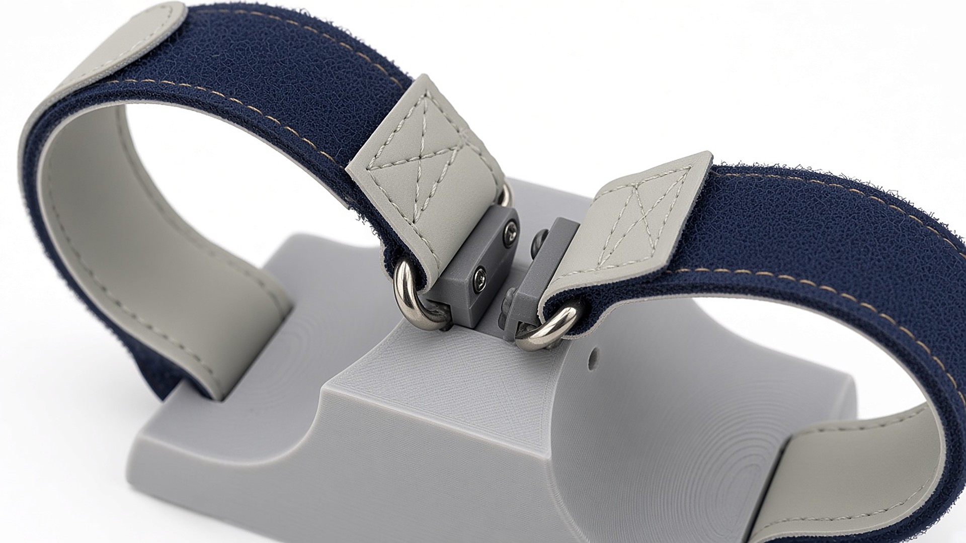 FlySpark ZD4 4-channel drone payload dropper release latch close-up – hook-and-loop strap D-rings held by the central metal latch pins